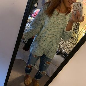 Green white black reverse weave sweater